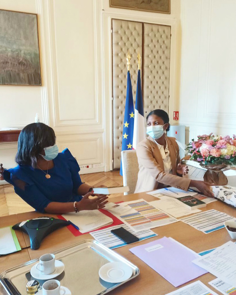 Christelle in a meeting at a French government office